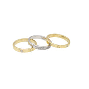 Three gold and white gold  Ring Bands for Men with embedded stones on a white background