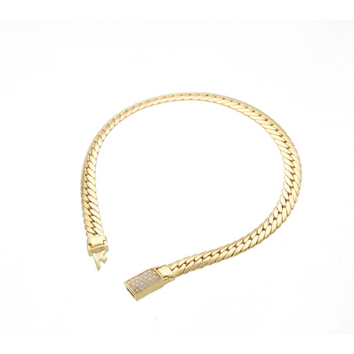 Top view of a 14K yellow gold hollow link bracelet on a white background showing the cubic zirconia encrusted push-in clasp.