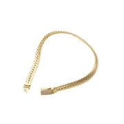 Side profile of a 4mm 14K yellow gold hollow link bracelet highlighting the polished finish and secure zirconia stone lock.