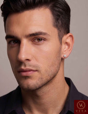 Lifestyle photo of a male model wearing a single 10K white gold diamond cluster screw-back earring, showing the 4.6mm scale and fit. By Veka Jewelry
