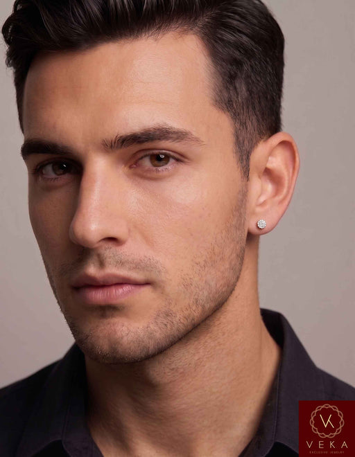 Lifestyle photo of a male model wearing a single 10K white gold diamond cluster screw-back earring, showing the 4.6mm scale and fit. By Veka Jewelry