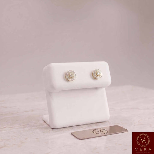 Men's round and baguette diamond stud earrings 0.33 CTW in 10K gold showcased on a premium white display stand by Veka Jewelry