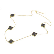 A 17-inch yellow gold station necklace with multiple synthetic black onyx clover-shaped stones in a white background.