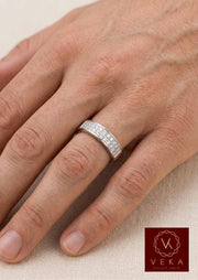 On-hand view of a 5.5mm men's diamond wedding band in white gold, demonstrating the comfortable fit and elegant double-row design.