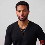 Man wearing 10K yellow gold natural diamond cross pendant on chain with black shirt Veka Jewelry