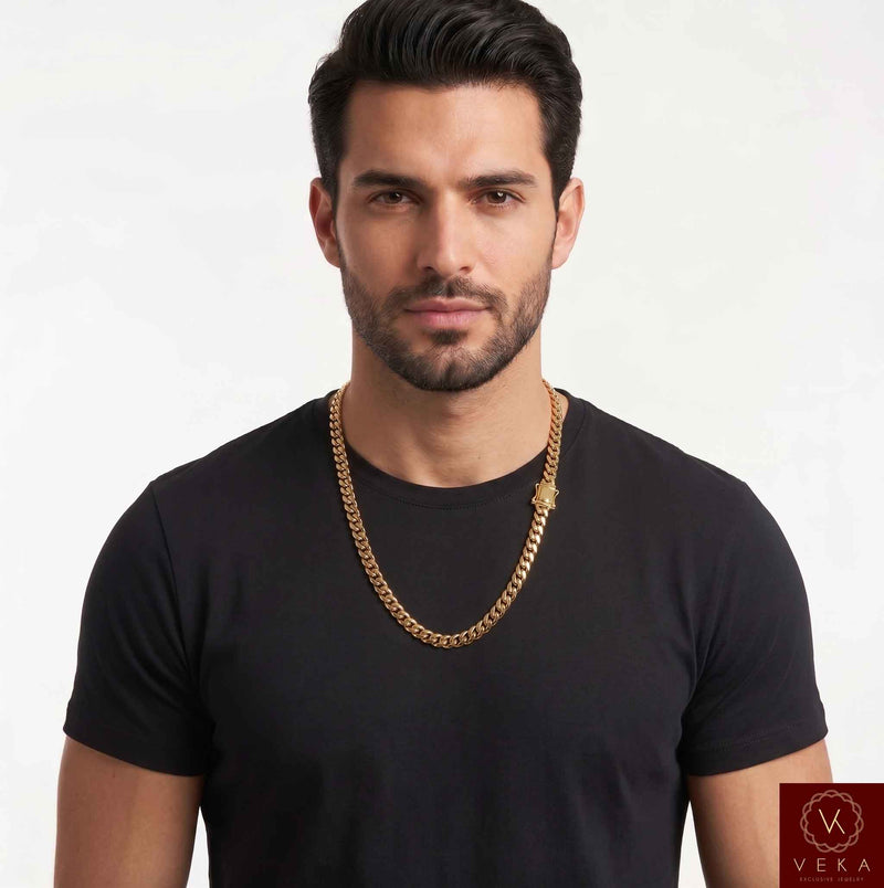 Man wearing a solid 10K yellow gold 7mm Miami Cuban link chain necklace over a black t-shirt, showcasing the fine jewelry fit and style.