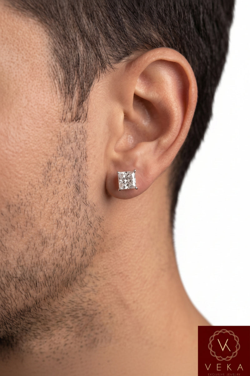 Professional close-up of a men's 6mm princess cut diamond stud earring in a 14k white gold basket setting, styled on a male model.