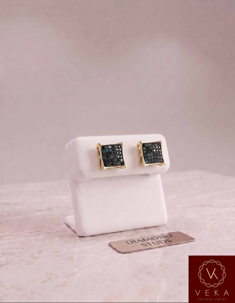 10K yellow gold men's black diamond stud earrings displayed on a white leather stand with VEKA jewelry logo