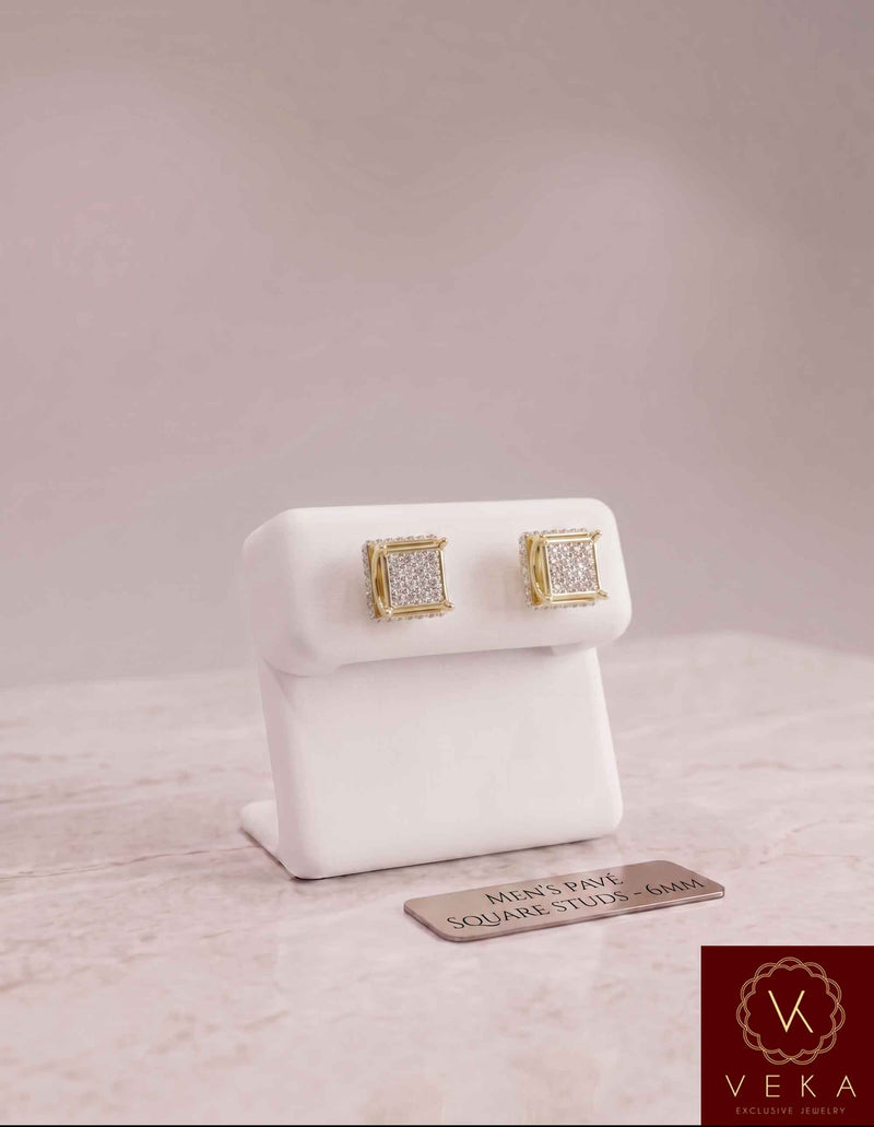 Men's 10K yellow gold diamond square cluster stud earrings 0.10ctw on a luxury white display stand, 6mm pave square studs by VEKA Jewelry