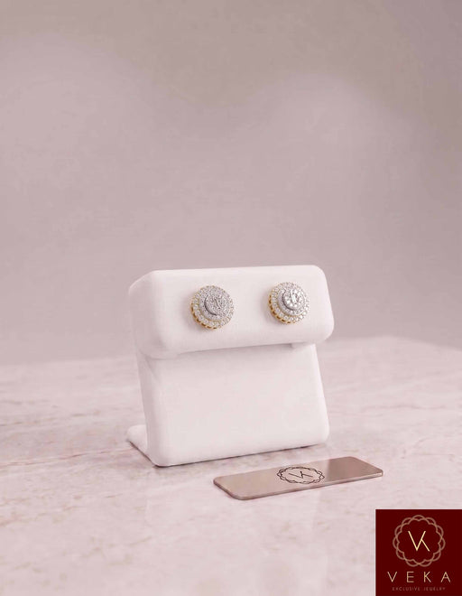 Men's 10K solid gold double halo moissanite stud earrings on a premium display stand by Veka Jewelry
