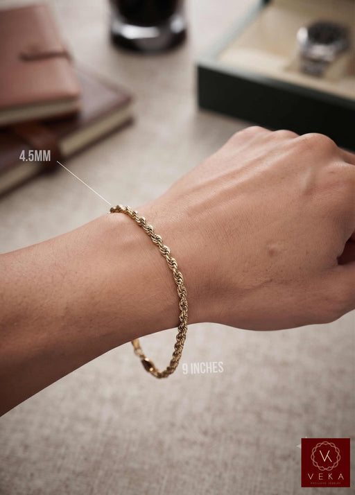 Man wearing a solid 10k gold 4.5mm rope bracelet measuring 9 inches long from Veka Jewelry