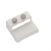 Angled studio shot of a pair of 1/4ctw round diamond cluster stud earrings in solid 10K gold on a white display clip.