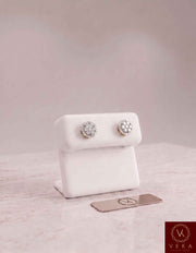 Men's 10K solid gold round diamond cluster stud earrings 8.5mm displayed on a white leather jewelry stand at Veka Jewelry.