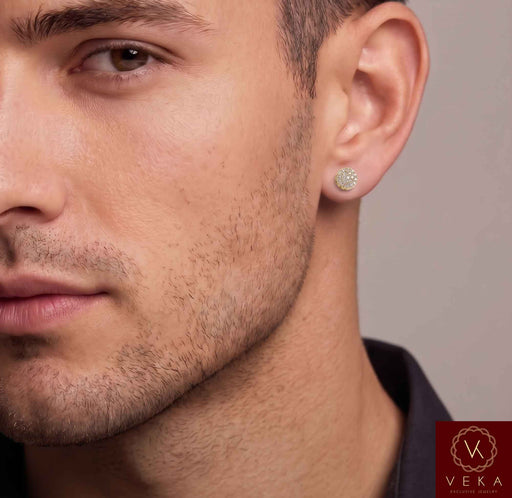 Close-up lifestyle portrait of a male model wearing a 10k yellow gold round brilliant lab-grown diamond halo stud earring from Veka Jewelry