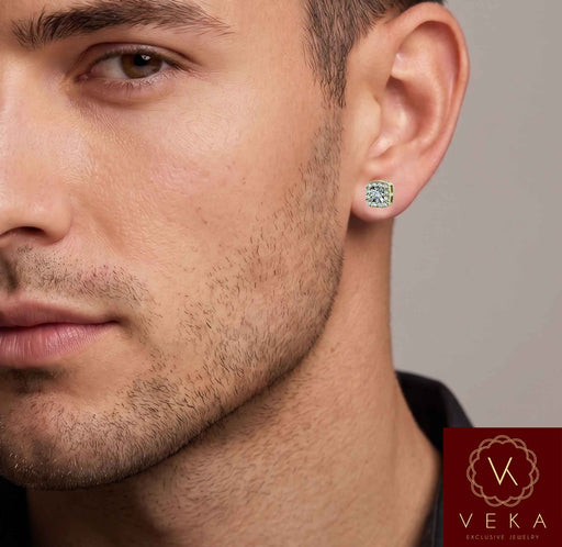 Close-up lifestyle portrait of a male model wearing a 10k yellow gold round brilliant lab-grown diamond halo stud earring from Veka Jewelry.