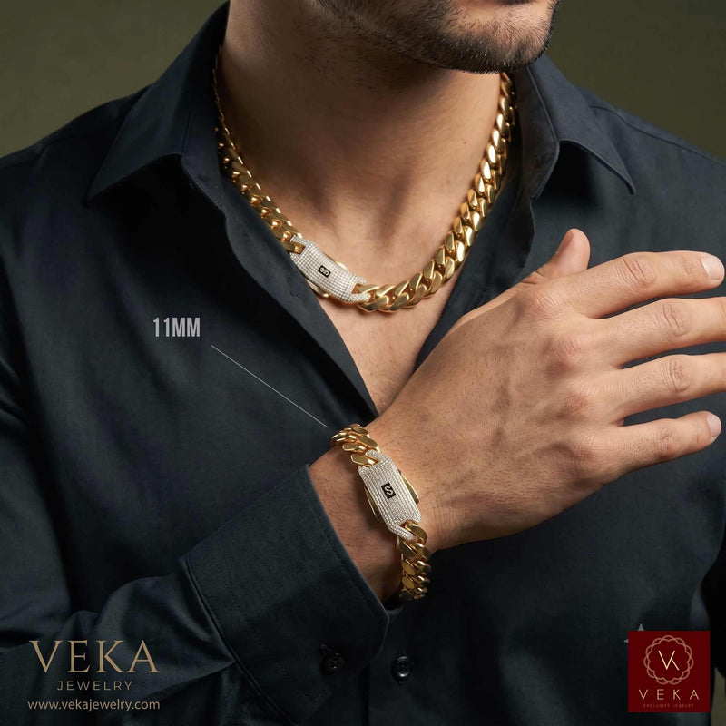 Male model wearing a solid 14K gold Monaco chain necklace and matching 11mm Monaco link bracelet on wrist from Veka Jewelry.