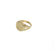 Side profile view of the polished 14K gold band showing the openwork cross feature.