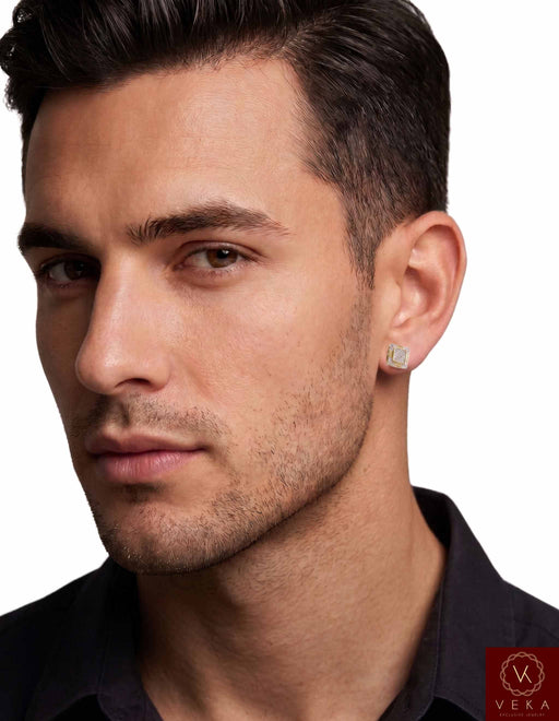 Close-up profile of a male model wearing an 8mm 10K yellow gold square-profile diamond stud earring against a clean white background.