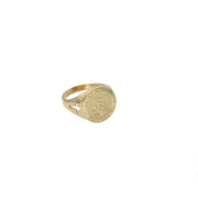 Side profile view of the polished 14K gold band showing the openwork cross feature.