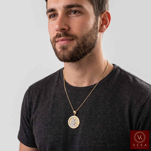 Men's genuine two-tone gold St. Michael medal pendant worn on a solid gold chain necklace by male model.
