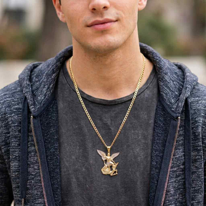 Young male model wearing a two-tone 14K gold Saint Michael pendant on a yellow gold chain with a casual grey hoodie.