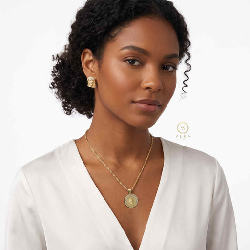 Cuban Female Model wearing a white blouse with a gold rope necklace and a  10k-two-tone-gold-saint-lazarus-san-lazaro-medal-pendant on. white backround
