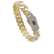 Angled view of a 10k yellow gold Monaco bangle featuring intercalated Swarovski crystal links and signature clasp