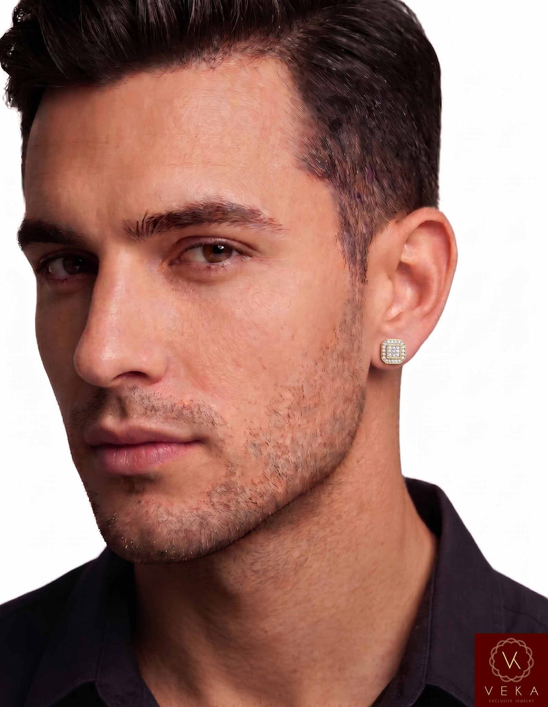 Close-up view of a male model wearing an 8mm octagonal 10k yellow gold diamond stud earring by Veka Jewelry, showcasing real-life scale and fit.