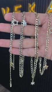 A video of a variety of gold anklets in real gold in a flat cuban link style
