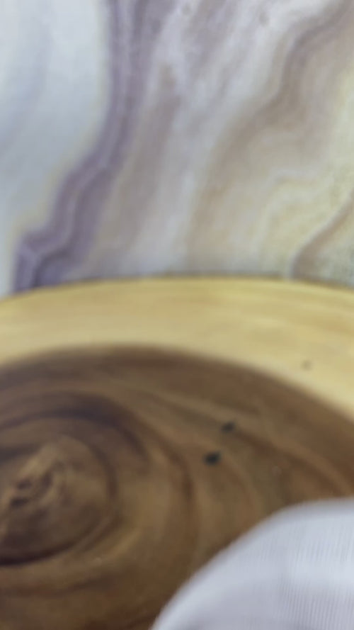 A black leather bracelet with gold-colored accents and textured Cuban links, featuring a lobster lock clasp.