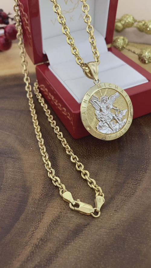 Real gold two-tone Saint Michael medal paired with gold chain necklace presented in luxury Veka Jewelry gift box.