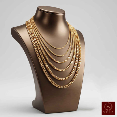 Solid 14K yellow gold round diamond-cut Franco chain necklaces displayed in multiple widths on a jewelry bust | Veka Jewelry