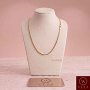 Primary product view of a solid 2mm Miami Cuban link 14k gold chain on a white display bust, highlighting the 16-inch length. Perfect for smaller sizes, by Veka Jewelry