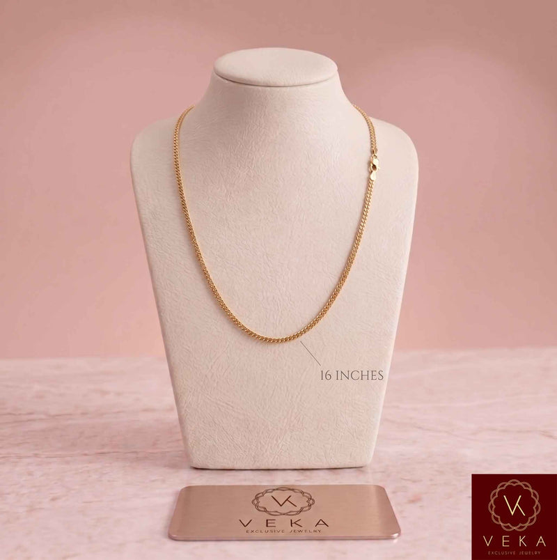 Primary product view of a solid 2mm Miami Cuban link 14k gold chain on a white display bust, highlighting the 16-inch length. Perfect for smaller sizes, by Veka Jewelry