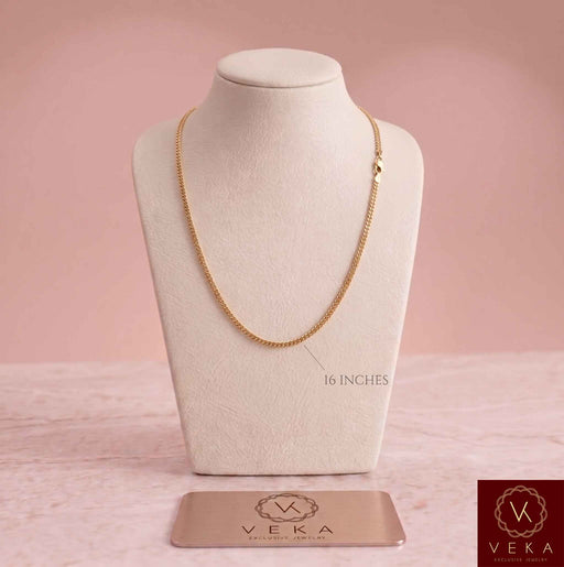 Primary product view of a solid 2mm Miami Cuban link 14k gold chain on a white display bust, highlighting the 16-inch length. Perfect for smaller sizes, by Veka Jewelry