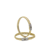 Two 10k yellow gold Monaco style bangles stacked to show different widths and the brilliant Swarovski stone setting