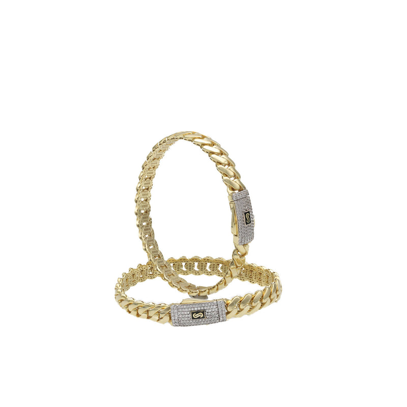 Two 10k yellow gold Monaco style bangles stacked to show different widths and the brilliant Swarovski stone setting