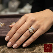 Female model wearing a luxury 10k gold teddy bear diamond ring on her ring finger, showcasing the scale and brilliance.