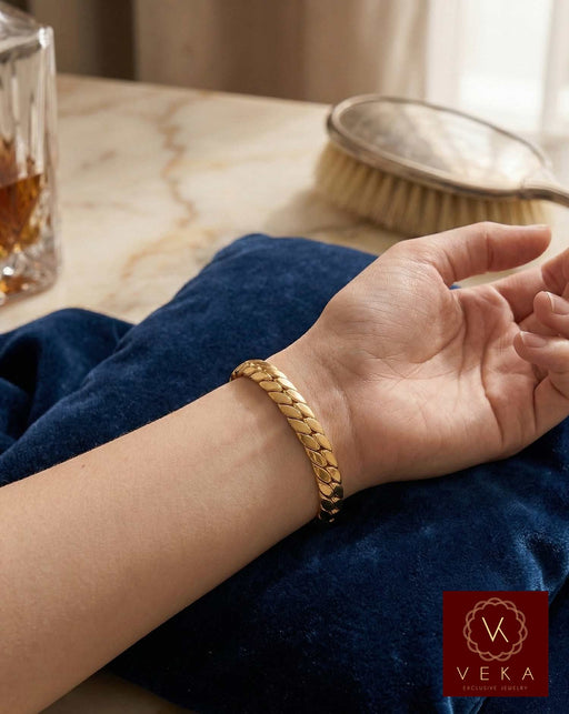 10K gold Italian tight link Cuban bracelet shown on a model's wrist, highlighting the secure fit and the elegant, compact link design.