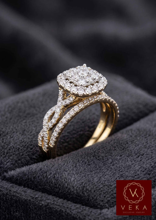 Side view of 1.5 CTW Natural Diamond engagement ring with twisted pavé shank and matching band in 14K gold
