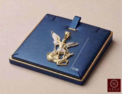 Two-tone solid 14K gold Saint Michael the Archangel pendant 52mm displayed on a luxury navy jewelry tray by Veka Jewelry.