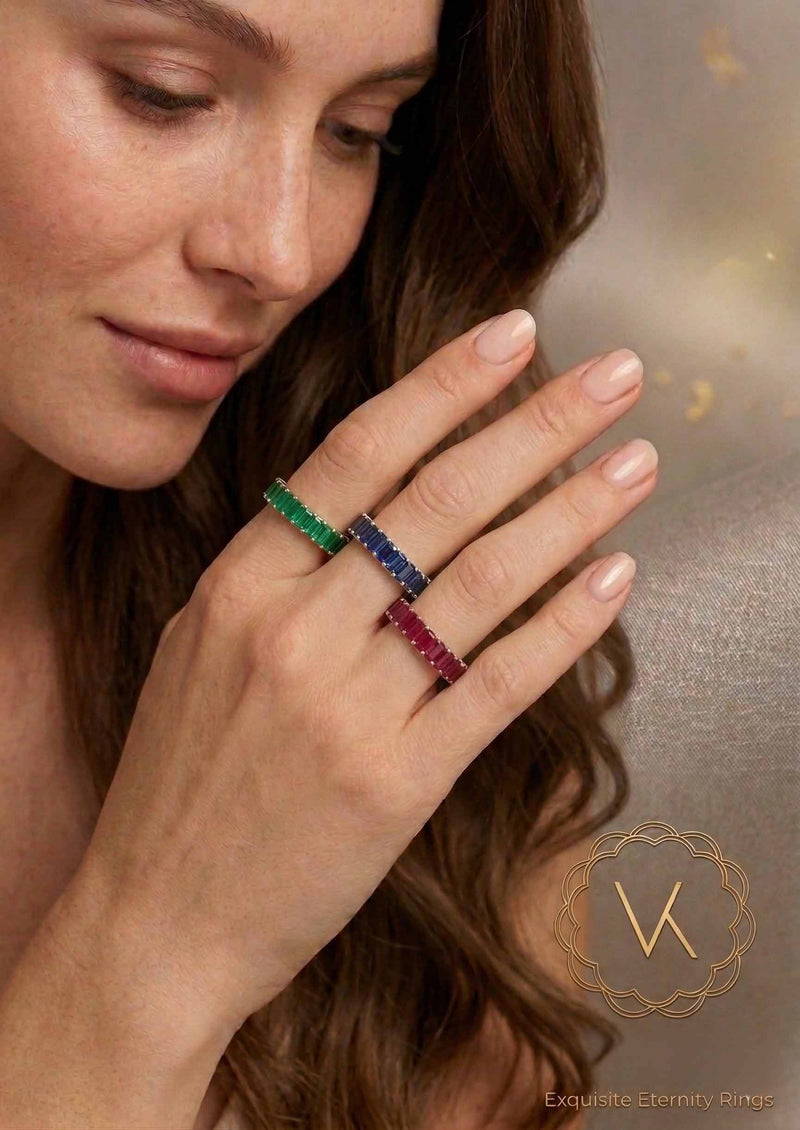 VEKA Jewelry 14K gold eternity bands featuring natural emerald-cut ruby, sapphire, and emerald on a model's hand