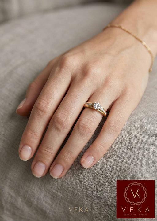 Woman wearing VEKA 14K yellow gold 0.25 Ctw diamond cluster engagement ring on hand.