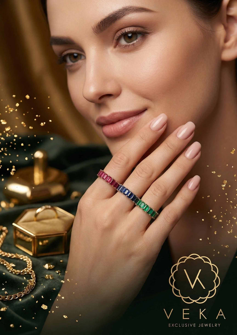 Elegant portrait of a model wearing VEKA emerald cut gemstone eternity bands in 14K yellow and white gold