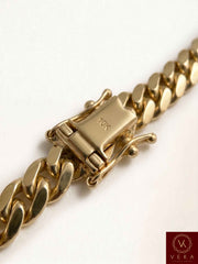 Macro closeup of the traditional box lock clasp with a 14K stamp and double safety latches on a VEKA Jewelry 6mm Miami Cuban link bracelet