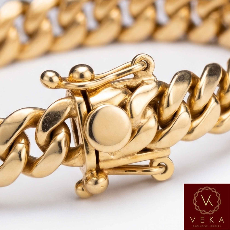 Macro closeup of the traditional box lock clasp with a 14K stamp and double safety latches on a VEKA Jewelry 9mm Miami Cuban link bracelet