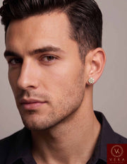Male model wearing a Veka Jewelry Men's Moissanite Cluster Stud Earring in 10K Yellow Gold.