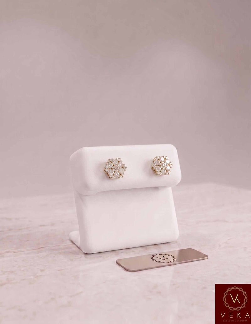 Pair of Men's Moissanite Cluster Stud Earrings by Veka Jewelry, 10K Yellow Gold with VVS stones on a white jewelry display stand