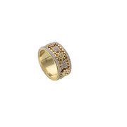 An angled, three-quarter view of the solid 10K gold mechanical gear band, highlighting the contrast between the yellow gold gears and the diamond pave sections