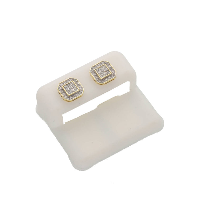 An angled studio shot of the 1/6 ctw natural diamond octagon stud earrings in 10k yellow gold showing the detailed pave setting